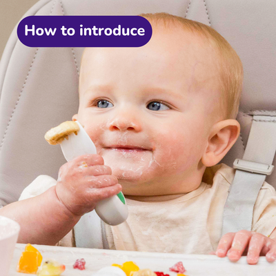 Baby eating with doddl baby fork
