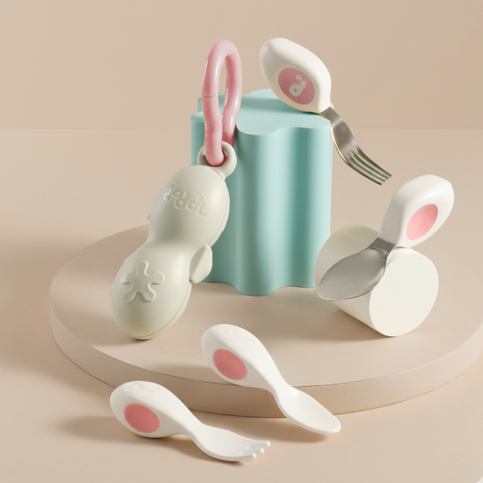 doddl baby cutlery and doddl toddler cutlery in Dusky Pink on beige background