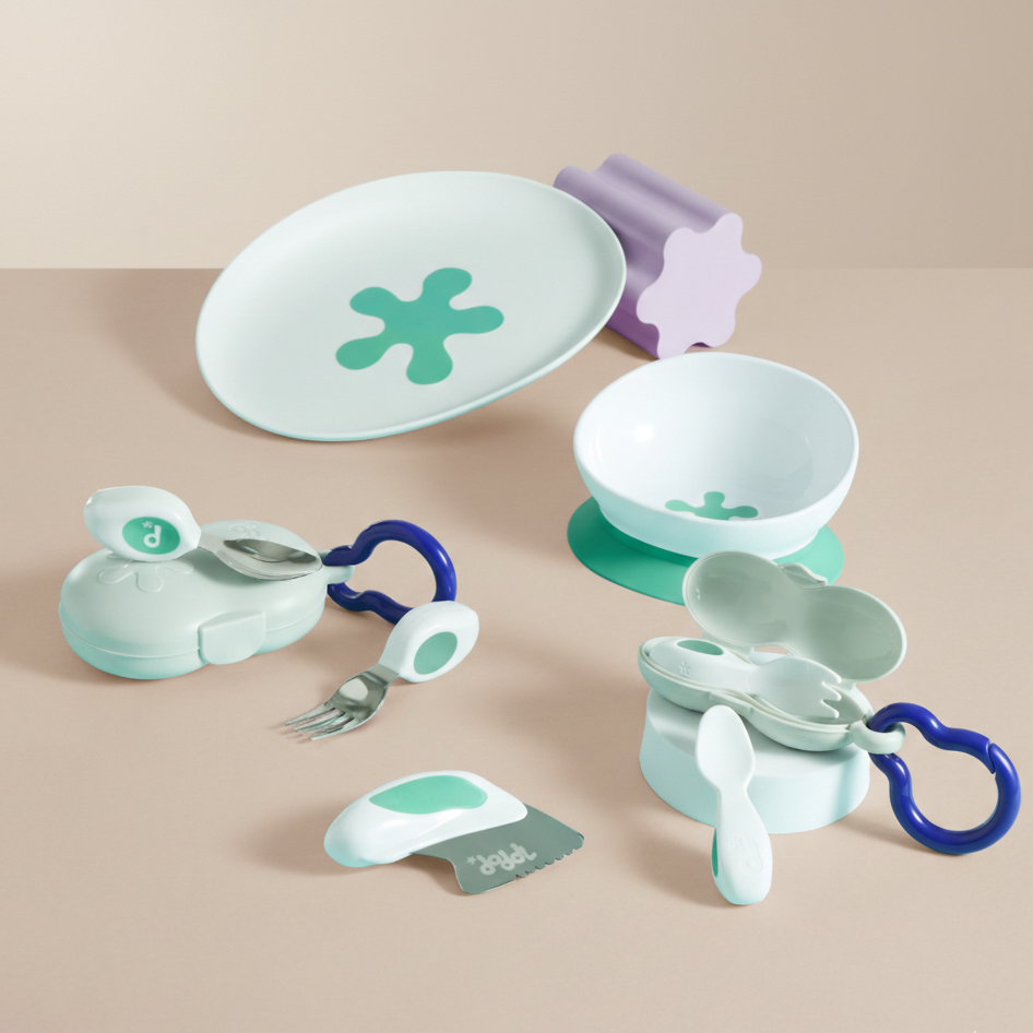 doddl baby to toddler feeding set on beige background